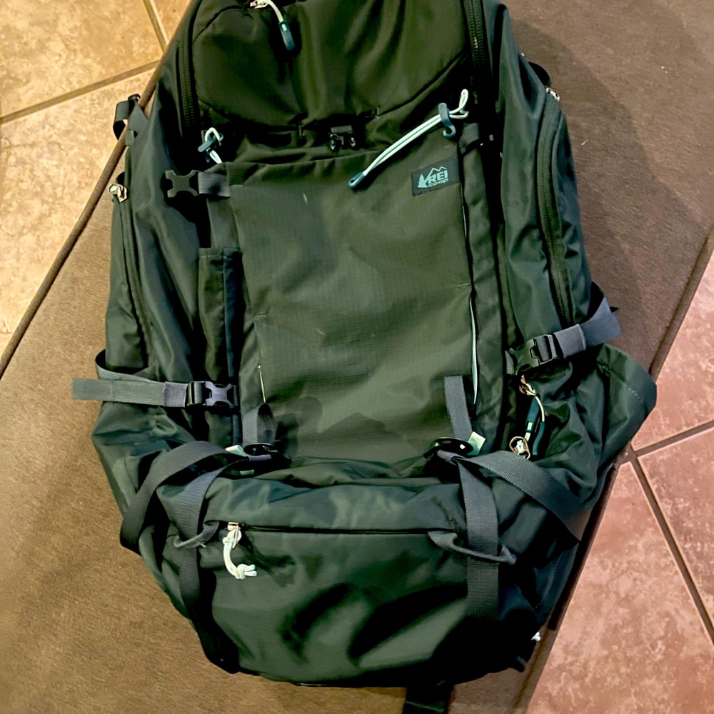 REI - 65L Traveling backpack.